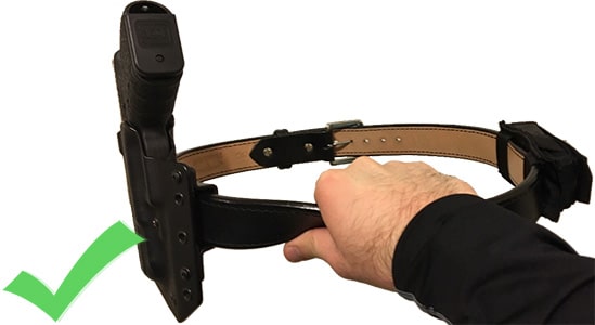 A demonstration of a properly stiff belt. The belt doesn't lose its shape when held up by itself with a gun and tourniquet on it.