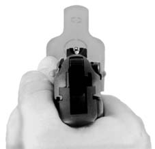 Pistol pointed at a target, point of view